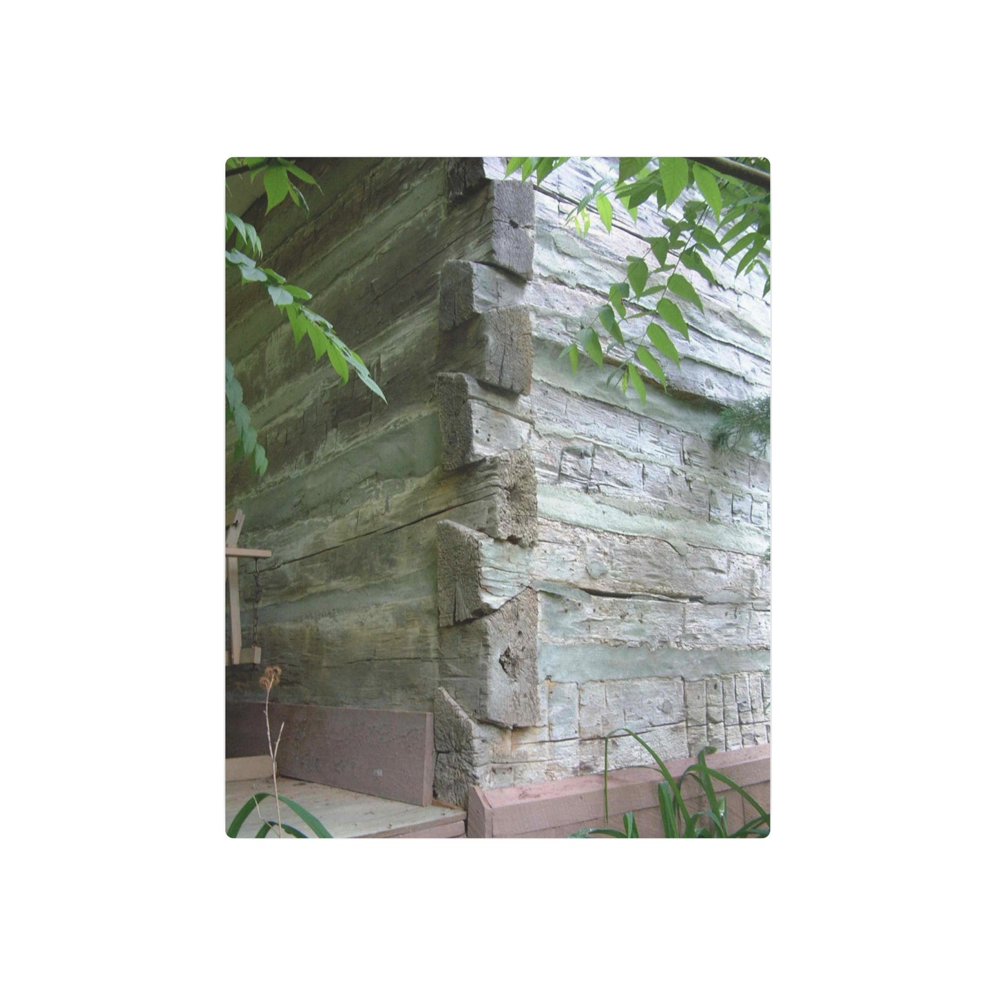 Metal Art Sign Showing Aged Log Home Walls