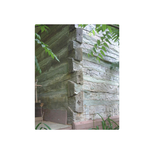 Metal Art Sign Showing Aged Log Home Walls